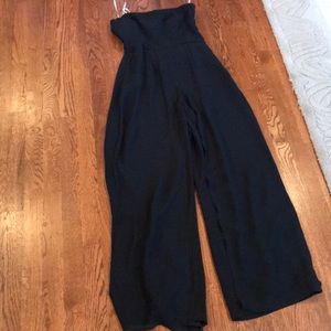 Black strapless, jumpsuit that looks like a dress.